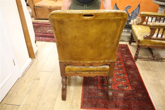 A pair of Victorian oak library chairs, upholstered in pale green leather, W.68cm D.76cm H.102cm
